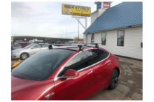 Dakdragers Tesla Model 3 rood schuin voor